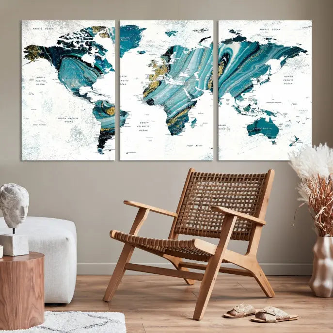 The modern living room features the World Map Wall Art Canvas Print, a three-panel abstract design on museum-quality canvases. The artwork includes a UV-protective coating and is ready to hang.