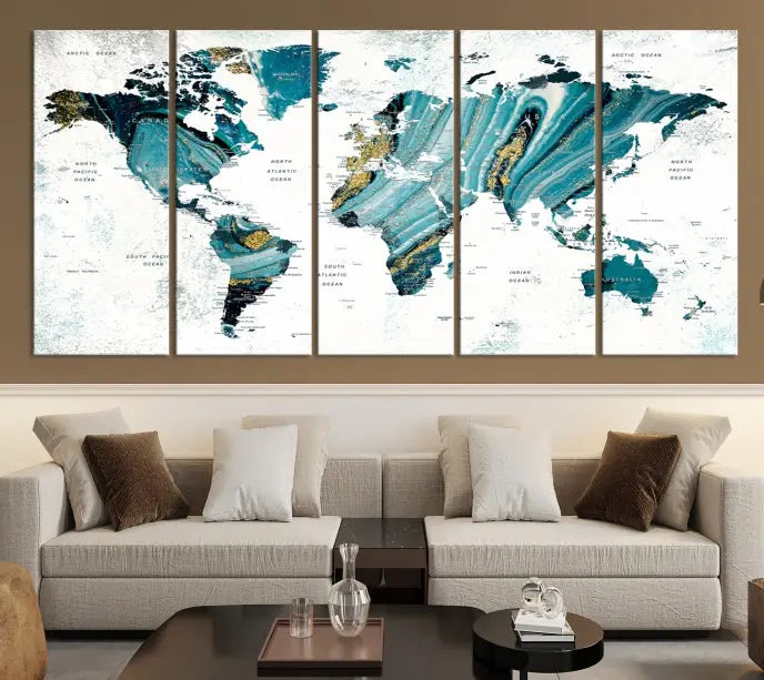 The modern living room features the World Map Wall Art Canvas Print, a three-panel abstract design on museum-quality canvases. The artwork includes a UV-protective coating and is ready to hang.