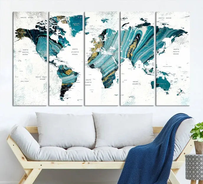 The modern living room features the World Map Wall Art Canvas Print, a three-panel abstract design on museum-quality canvases. The artwork includes a UV-protective coating and is ready to hang.