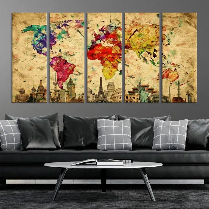 The World Map Wall Art Canvas Print is a museum-quality triptych featuring a vivid world map adorned with famous landmarks underneath. Each panel is expertly framed to add an air of sophistication to any space.