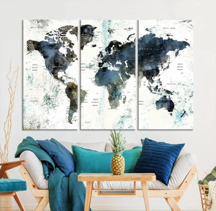 The 5-panel World Map Wall Art Print is displayed on a dark wall. Crafted on museum-quality canvas with a UV-protective coating, it comes ready to hang for an instant touch of elegance.