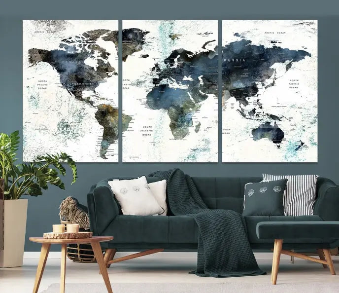 The 5-panel World Map Wall Art Print is displayed on a dark wall. Crafted on museum-quality canvas with a UV-protective coating, it comes ready to hang for an instant touch of elegance.