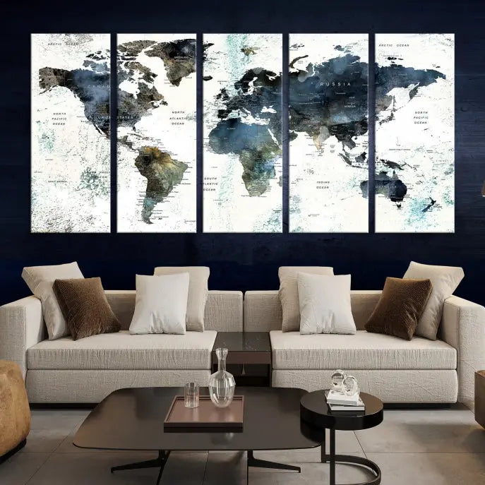 The 5-panel World Map Wall Art Print is displayed on a dark wall. Crafted on museum-quality canvas with a UV-protective coating, it comes ready to hang for an instant touch of elegance.