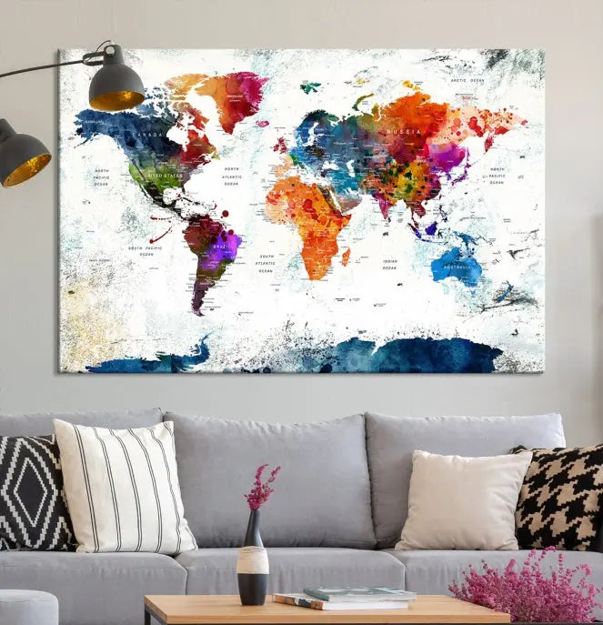 A modern living room boasting a vibrant World Map Wall Art Watercolor Map Canvas Print on the wall.