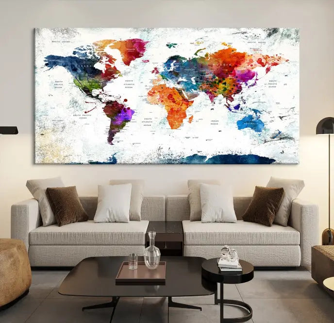 A modern living room boasting a vibrant World Map Wall Art Watercolor Map Canvas Print on the wall.