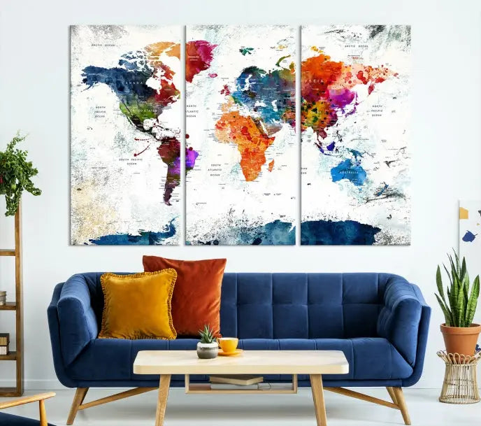 A modern living room boasting a vibrant World Map Wall Art Watercolor Map Canvas Print on the wall.