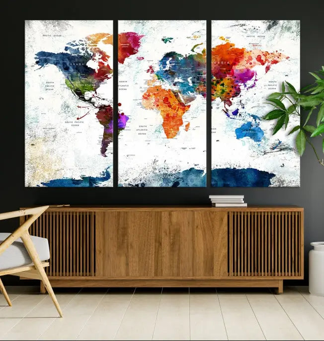 A modern living room boasting a vibrant World Map Wall Art Watercolor Map Canvas Print on the wall.