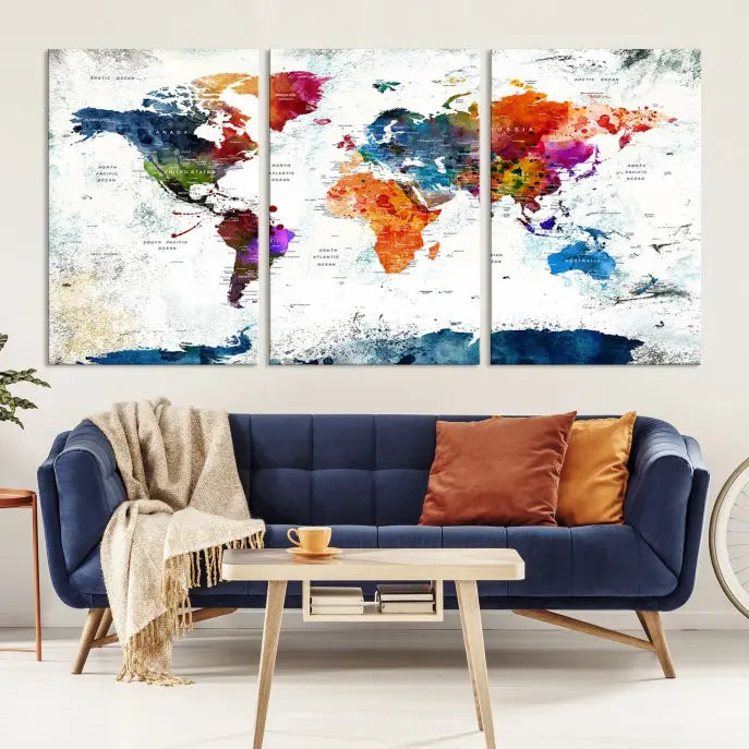 A modern living room boasting a vibrant World Map Wall Art Watercolor Map Canvas Print on the wall.