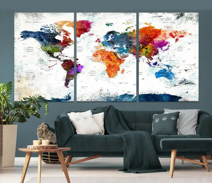 A modern living room boasting a vibrant World Map Wall Art Watercolor Map Canvas Print on the wall.