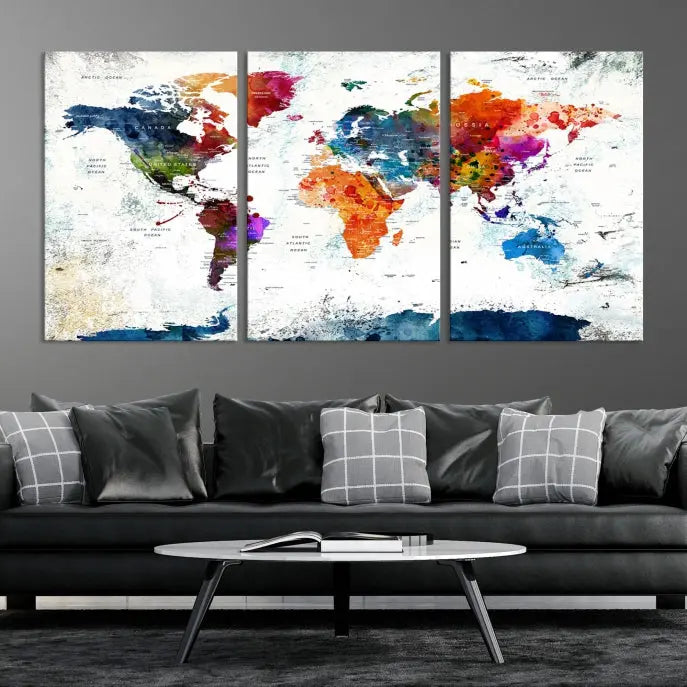 A modern living room boasting a vibrant World Map Wall Art Watercolor Map Canvas Print on the wall.