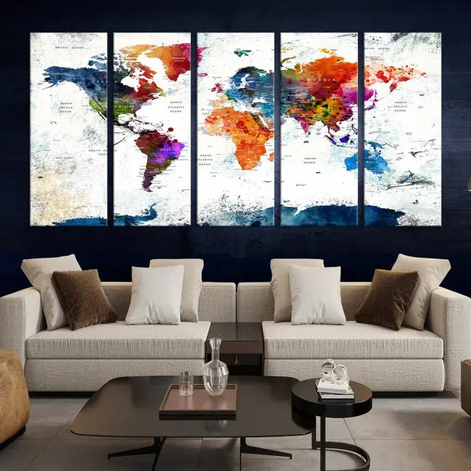 A modern living room boasting a vibrant World Map Wall Art Watercolor Map Canvas Print on the wall.