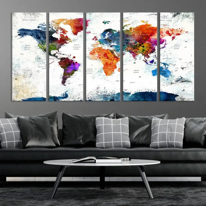 A modern living room boasting a vibrant World Map Wall Art Watercolor Map Canvas Print on the wall.