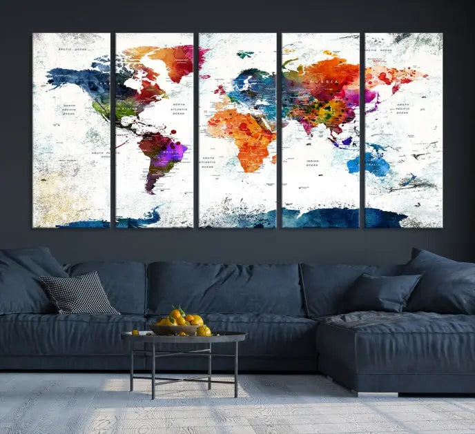 A modern living room boasting a vibrant World Map Wall Art Watercolor Map Canvas Print on the wall.