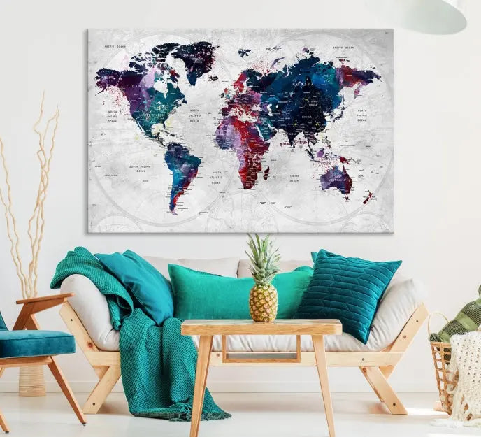 The "World Map Wall Art Watercolor Wall Art Canvas Print," a triptych featuring a vibrant world map, is gallery wrapped on museum-quality canvas and enhances the dark wall.