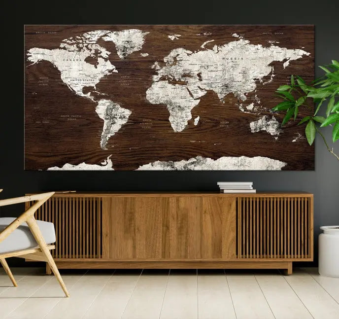 Displayed on the wall is the "World Map Wall Art on Wooden Brown Background World Map Canvas Print," crafted with museum-quality canvas and enhanced by a UV-protective coating to ensure lasting beauty.