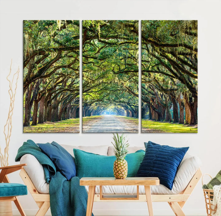 The "Wormsloe State Plantation Driveway Wall Art Canvas Print," crafted on museum-quality canvas with high-resolution printing, showcases a tree-lined path in a modern room.