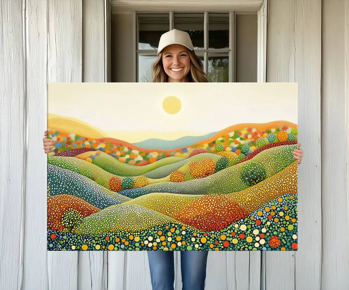 The YAYOI KUSAMA Colorful Dot Art Landscape Canvas, a framed abstract pointillism piece inspired by nature featuring vibrant rolling hills and a sun, adds gallery-quality elegance to your living space.