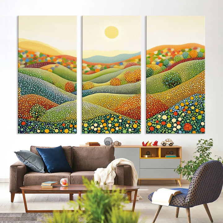 The YAYOI KUSAMA Colorful Dot Art Landscape Canvas, a framed abstract pointillism piece inspired by nature featuring vibrant rolling hills and a sun, adds gallery-quality elegance to your living space.