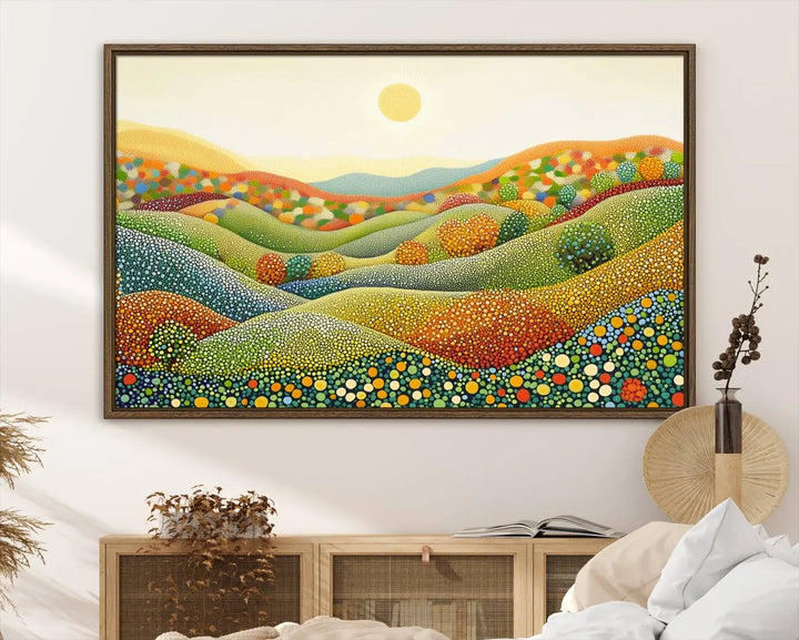 The YAYOI KUSAMA Colorful Dot Art Landscape Canvas, a framed abstract pointillism piece inspired by nature featuring vibrant rolling hills and a sun, adds gallery-quality elegance to your living space.