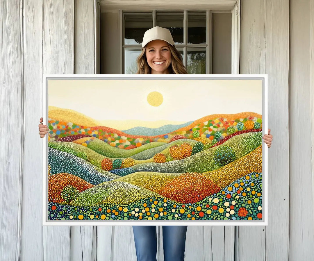 The YAYOI KUSAMA Colorful Dot Art Landscape Canvas, a framed abstract pointillism piece inspired by nature featuring vibrant rolling hills and a sun, adds gallery-quality elegance to your living space.