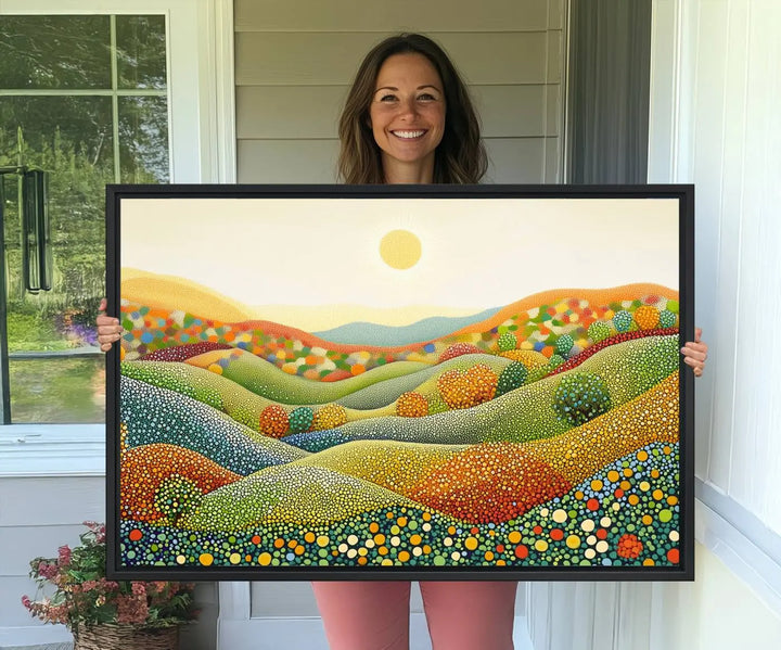 The YAYOI KUSAMA Colorful Dot Art Landscape Canvas, a framed abstract pointillism piece inspired by nature featuring vibrant rolling hills and a sun, adds gallery-quality elegance to your living space.