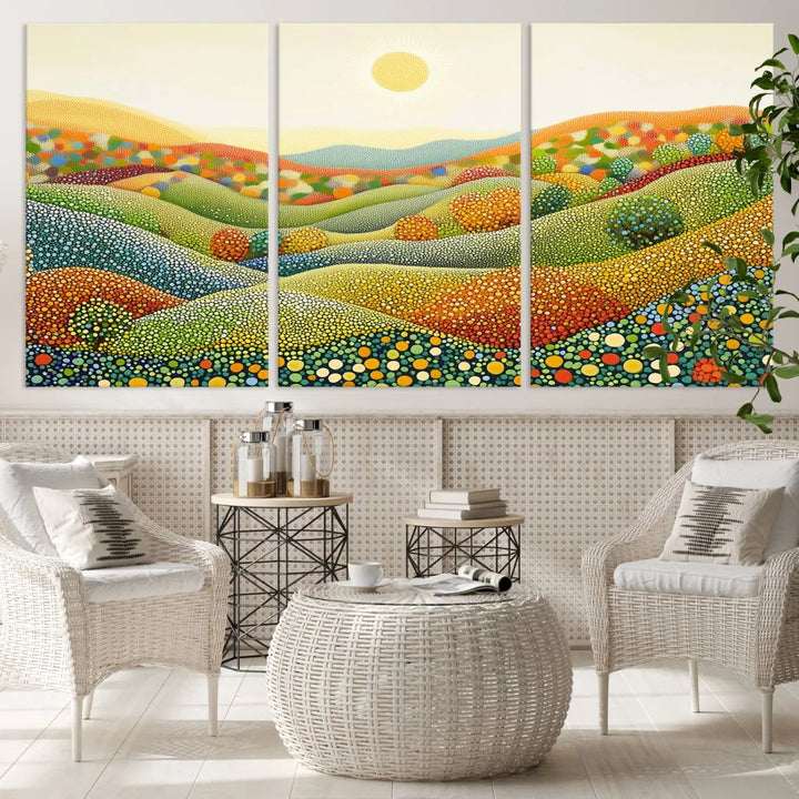 A triptych of the YAYOI KUSAMA Wall Art features a colorful dot art landscape on canvas with vibrant rolling hills and a sun, reminiscent of abstract pointillism inspired by nature.