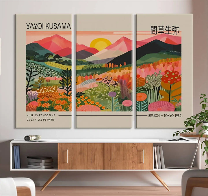 The Yayoi Kusama 1986 Wall Art Print Landscape Canvas Print, a vibrant triptych with abstract landscape art and bold floral motifs, serves as a stunning centerpiece for contemporary décor enthusiasts in this stylish living room.