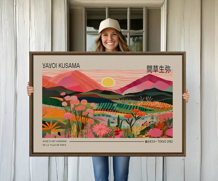 A Yayoi Kusama landscape print features vibrant floral mountains.
