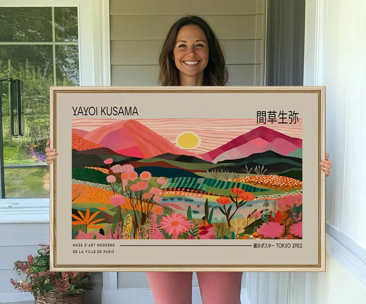 A Yayoi Kusama landscape print features vibrant floral mountains.
