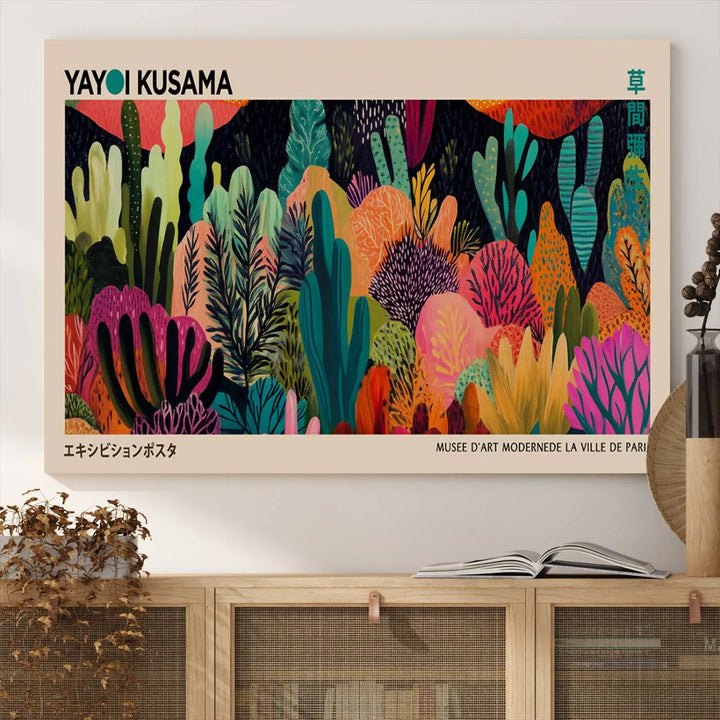 The vibrant canvas print of wall art features abstract plants, with the elegant text "Yayoi Kusama Wall Art Canvas Print" displayed on the colorful frame.