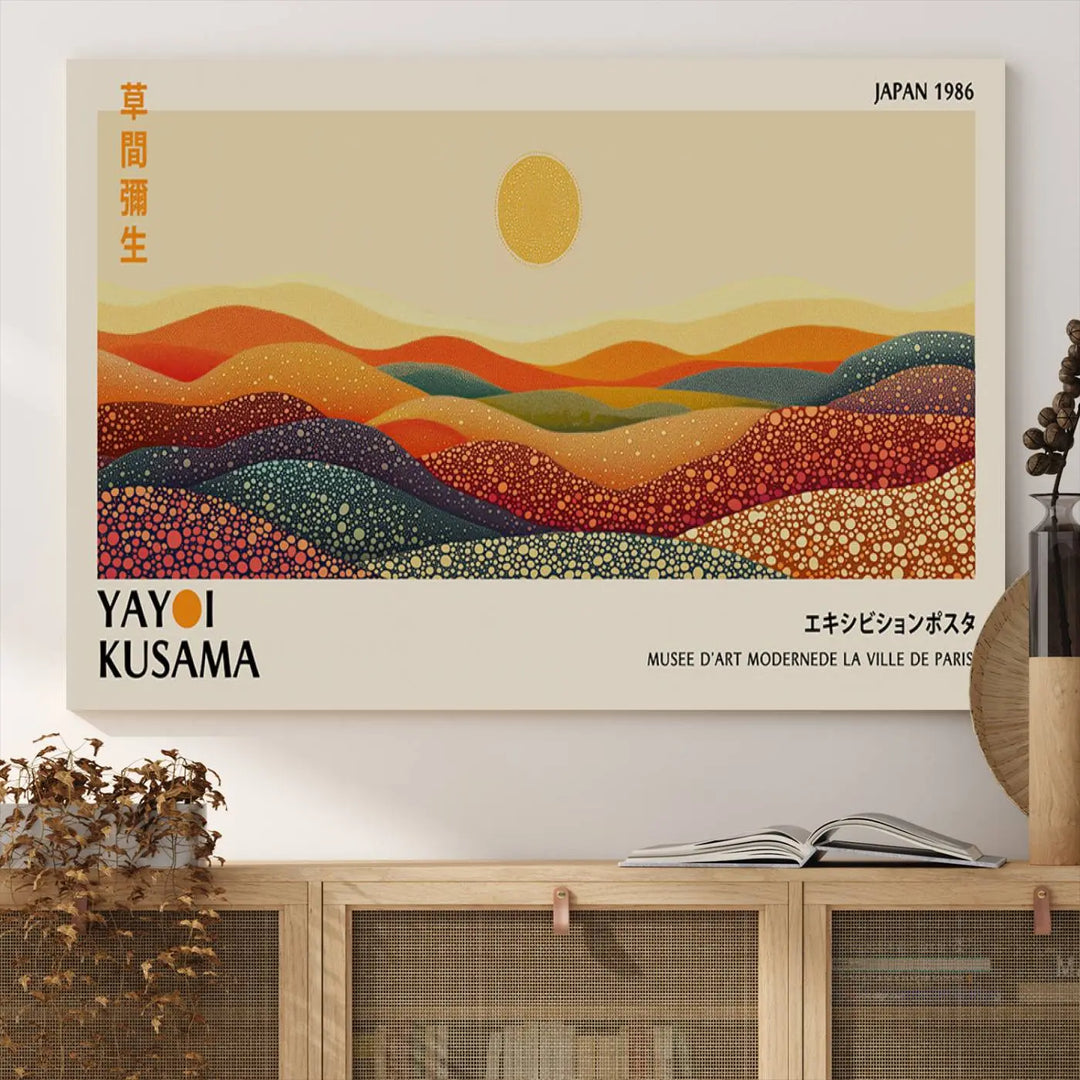 The Yayoi Kusama Wall Art Print is a vibrant abstract landscape canvas featuring colorful, dotted hills and a sun, reminiscent of Yayoi Kusama's iconic designs.