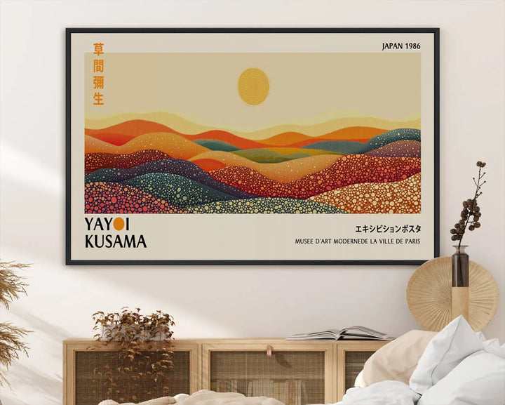 The Yayoi Kusama Wall Art Print is a vibrant abstract landscape canvas featuring colorful, dotted hills and a sun, reminiscent of Yayoi Kusama's iconic designs.