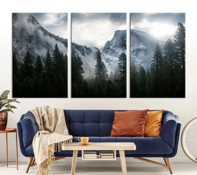 A captivating wall art depicting foggy mountains and the iconic El Capitan from Yosemite National Park graces the wall, infusing the living room with a natural touch.