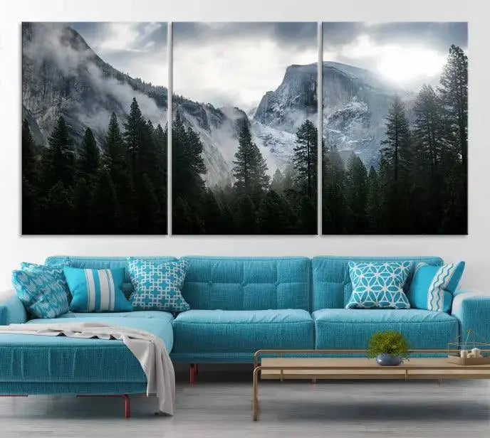 A captivating wall art depicting foggy mountains and the iconic El Capitan from Yosemite National Park graces the wall, infusing the living room with a natural touch.