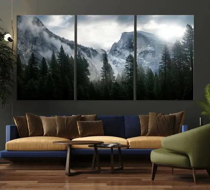 A captivating wall art depicting foggy mountains and the iconic El Capitan from Yosemite National Park graces the wall, infusing the living room with a natural touch.