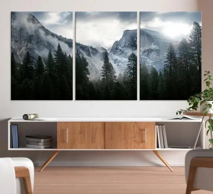 A captivating wall art depicting foggy mountains and the iconic El Capitan from Yosemite National Park graces the wall, infusing the living room with a natural touch.