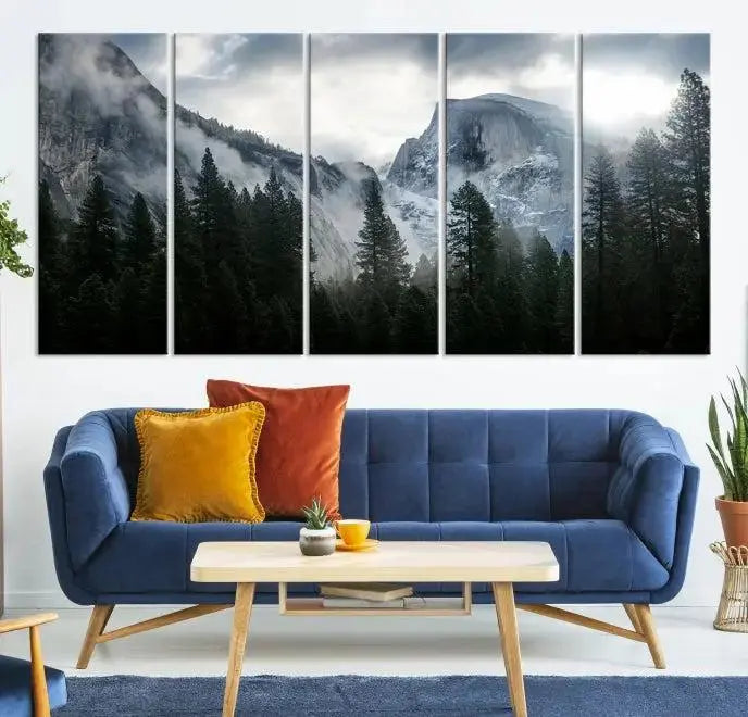 A captivating wall art depicting foggy mountains and the iconic El Capitan from Yosemite National Park graces the wall, infusing the living room with a natural touch.