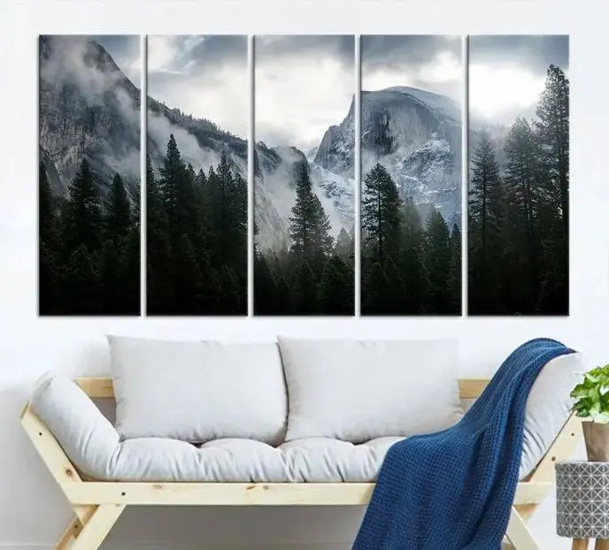 A captivating wall art depicting foggy mountains and the iconic El Capitan from Yosemite National Park graces the wall, infusing the living room with a natural touch.