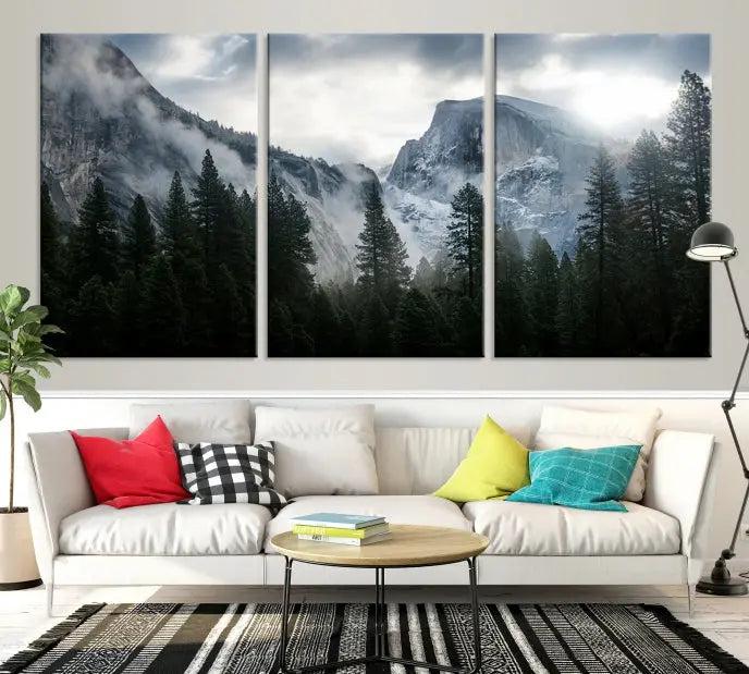 A captivating wall art depicting foggy mountains and the iconic El Capitan from Yosemite National Park graces the wall, infusing the living room with a natural touch.