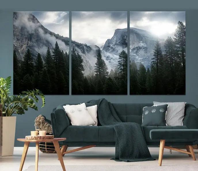 A captivating wall art depicting foggy mountains and the iconic El Capitan from Yosemite National Park graces the wall, infusing the living room with a natural touch.