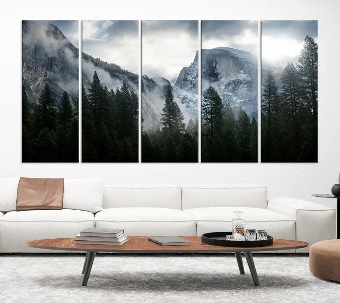 A captivating wall art depicting foggy mountains and the iconic El Capitan from Yosemite National Park graces the wall, infusing the living room with a natural touch.