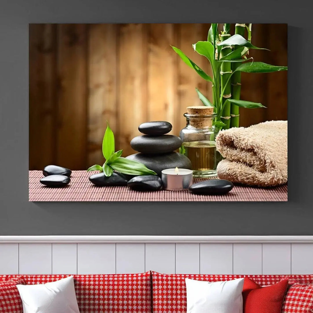 The Zen Serenity Triptych Canvas Art adorns the wall, featuring a pink lotus flower, balancing stones, towels, and bamboo.