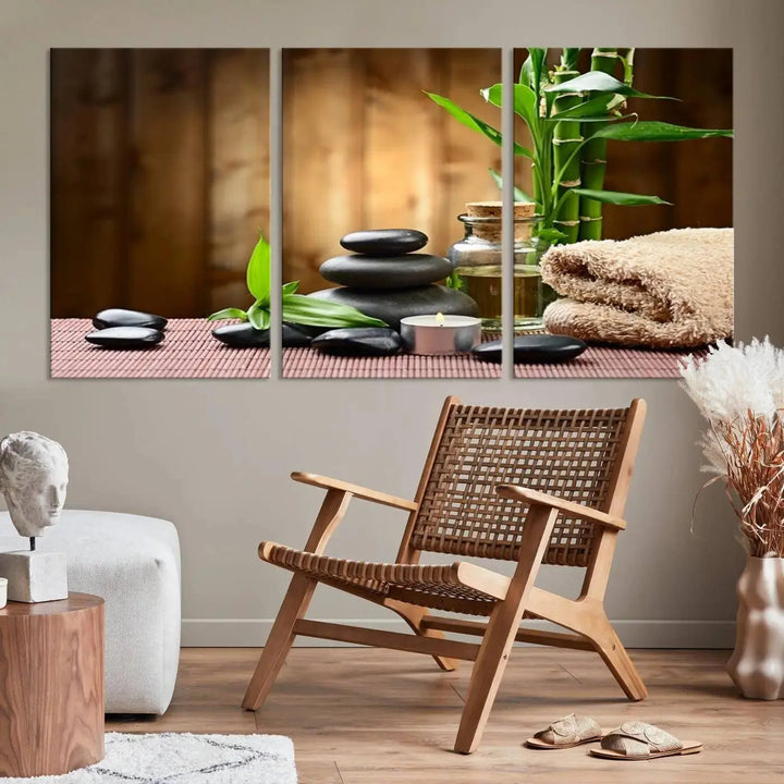 The Zen Serenity Triptych Canvas Art adorns the wall, featuring a pink lotus flower, balancing stones, towels, and bamboo.