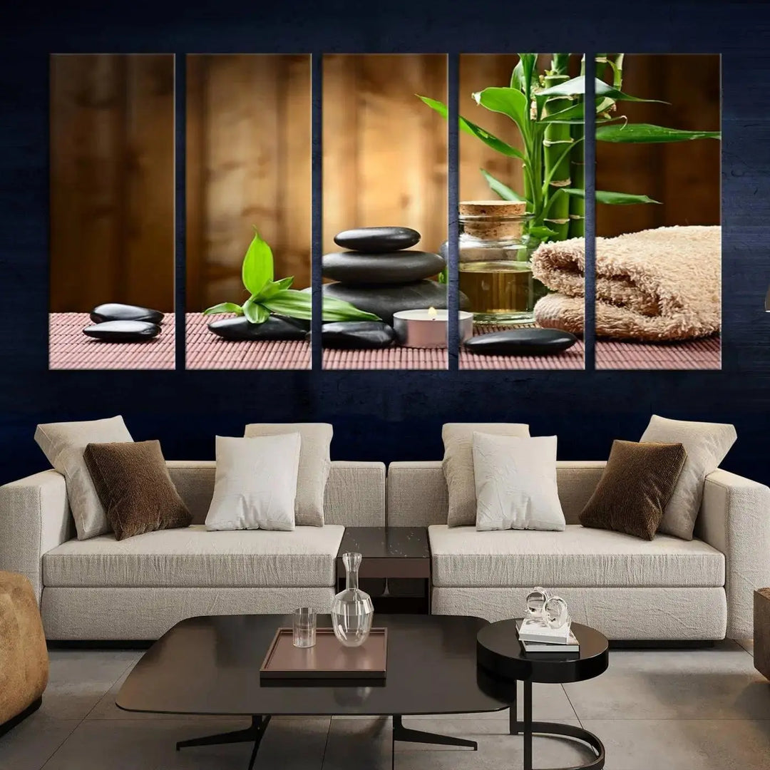 The Zen Serenity Triptych Canvas Art adorns the wall, featuring a pink lotus flower, balancing stones, towels, and bamboo.