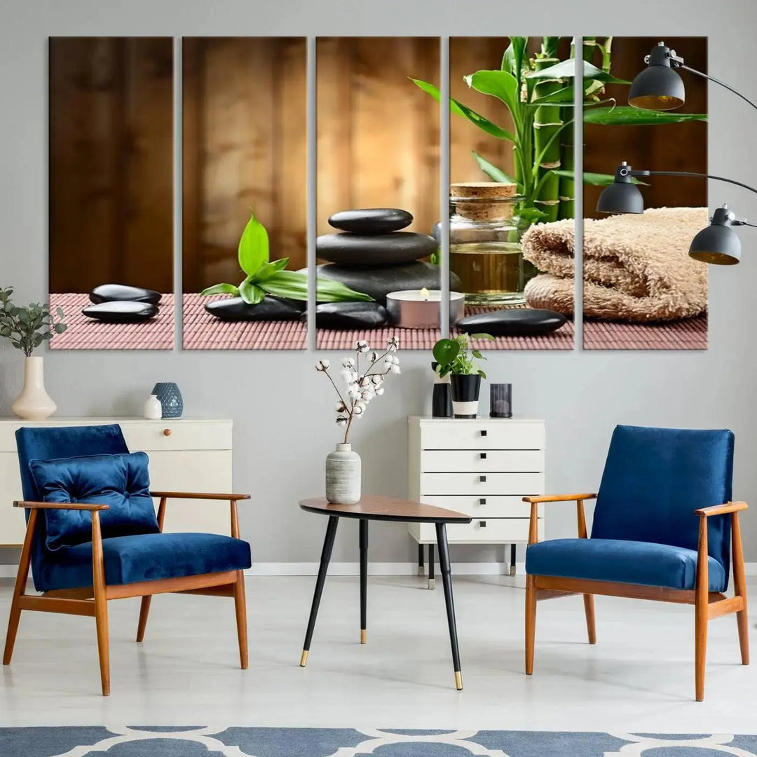 The Zen Serenity Triptych Canvas Art adorns the wall, featuring a pink lotus flower, balancing stones, towels, and bamboo.