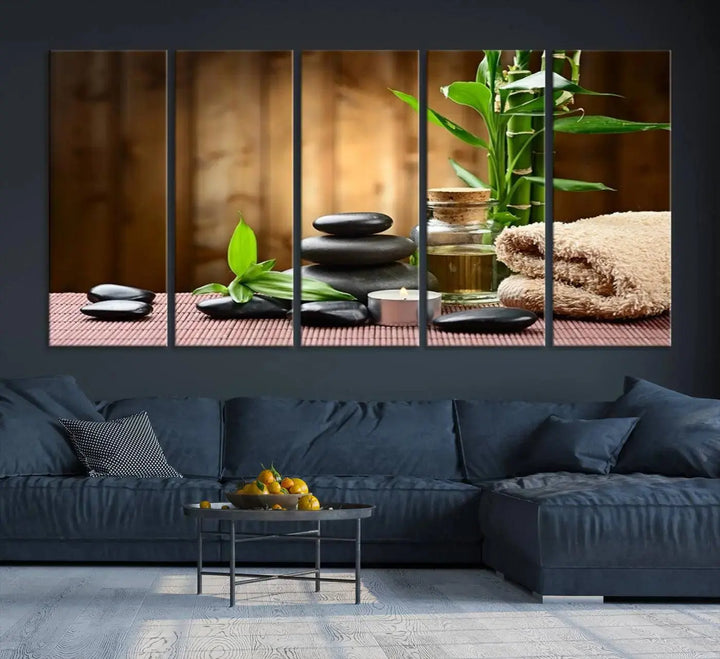 The Zen Serenity Triptych Canvas Art adorns the wall, featuring a pink lotus flower, balancing stones, towels, and bamboo.