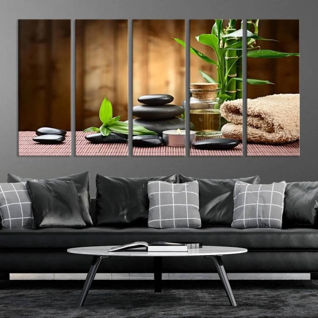 The Zen Serenity Triptych Canvas Art adorns the wall, featuring a pink lotus flower, balancing stones, towels, and bamboo.