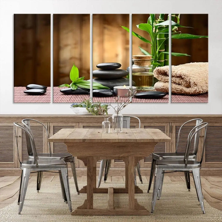 The Zen Serenity Triptych Canvas Art adorns the wall, featuring a pink lotus flower, balancing stones, towels, and bamboo.