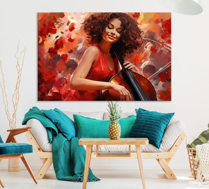 The "Abstract African American Musician Woman Playing the Cello" is a stunning three-panel piece presented on a gallery-wrapped, museum-quality canvas. It depicts a woman in red playing a cello amidst abstract red flowers. The artwork features a UV-protective coating to preserve its vibrant beauty when mounted on a white wall.