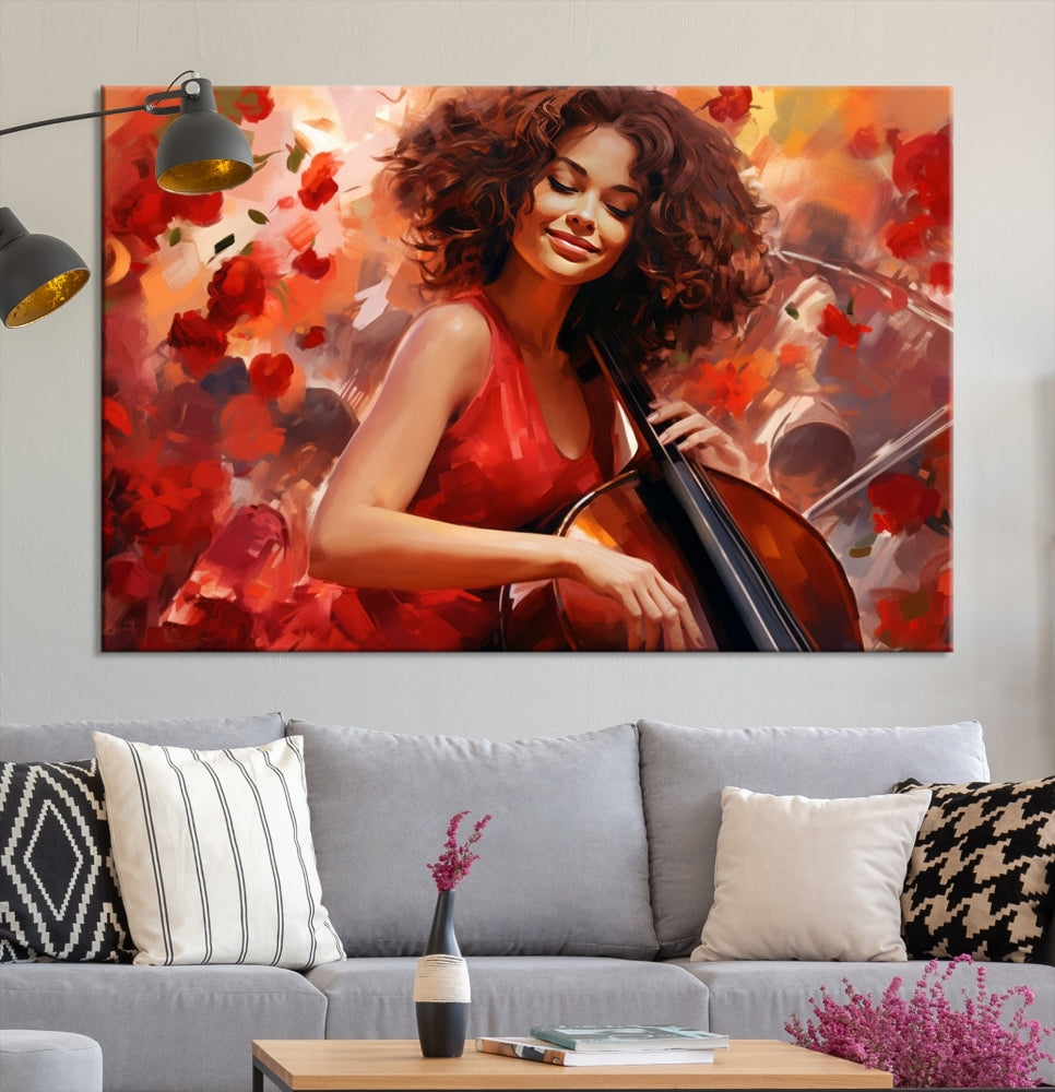 The "Abstract African American Musician Woman Playing the Cello" is a stunning three-panel piece presented on a gallery-wrapped, museum-quality canvas. It depicts a woman in red playing a cello amidst abstract red flowers. The artwork features a UV-protective coating to preserve its vibrant beauty when mounted on a white wall.